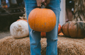man holding pumpkin