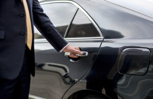 chauffeur opening the door